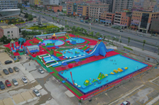 Our company set up a new giant inflatable water park on land for rental in Dongguan city