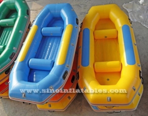 4 persons finishing or drifting inflatable raft